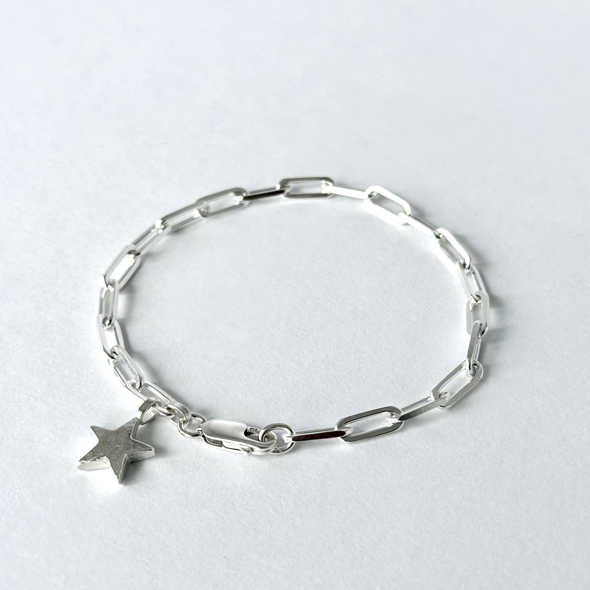 Silver bracelet with silver star