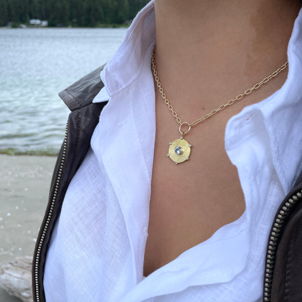 Gold necklace with light blue sapphire and diamonds