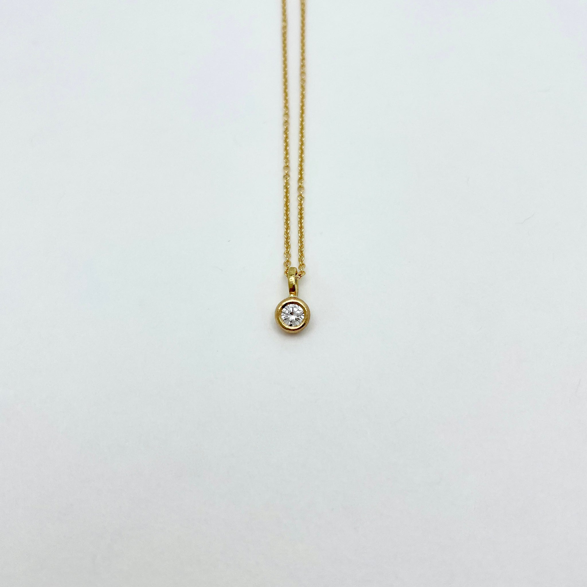 Gold necklace with diamond charm