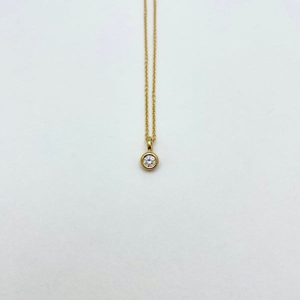 Gold necklace with diamond charm