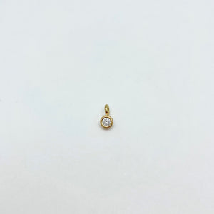 Gold charm with diamond