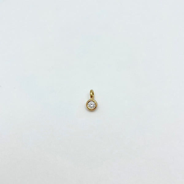 Gold charm with diamond