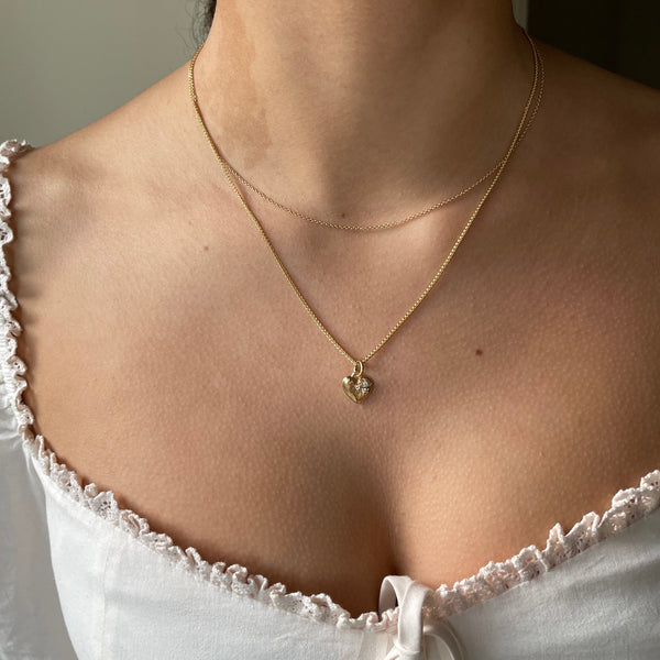 Gold necklace with heart and diamonds