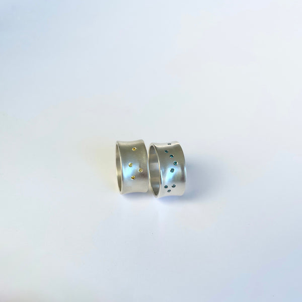 Silver ring with teal blue diamonds