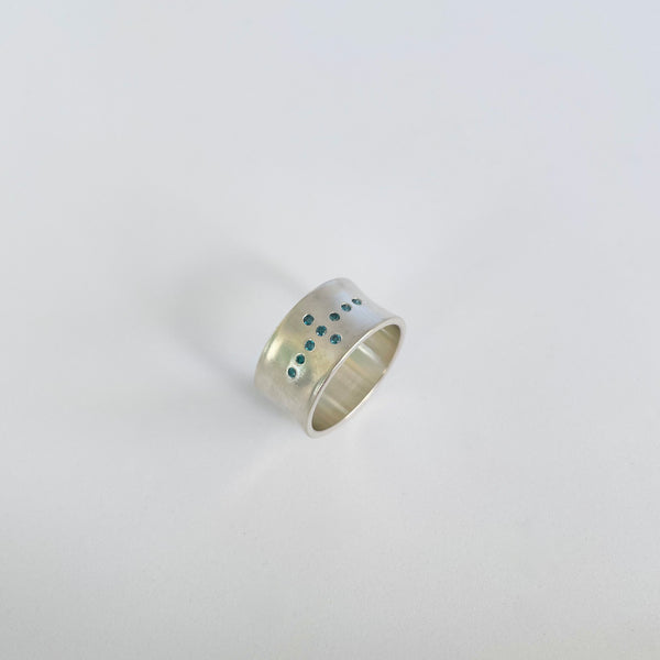 Silver ring with 9 teal blue diamonds