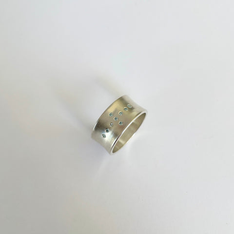 Silver ring with 9 aqua blue diamonds