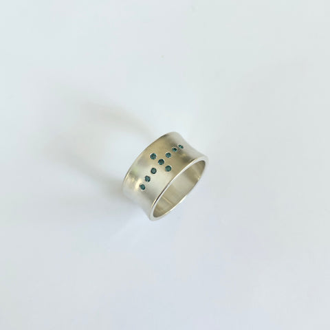 Silver ring with 9 teal blue diamonds