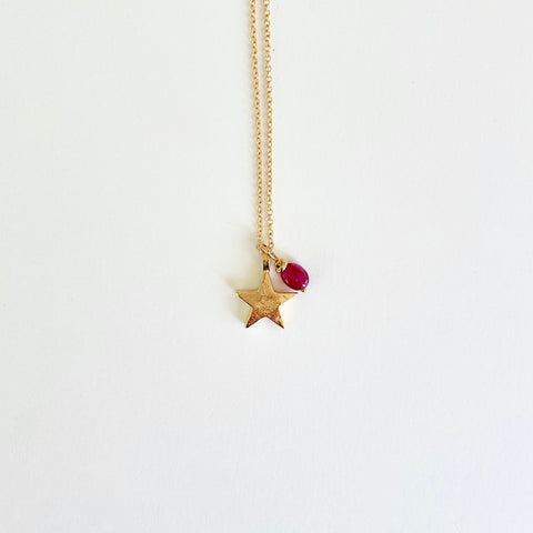 Gold Necklace with star and ruby charm