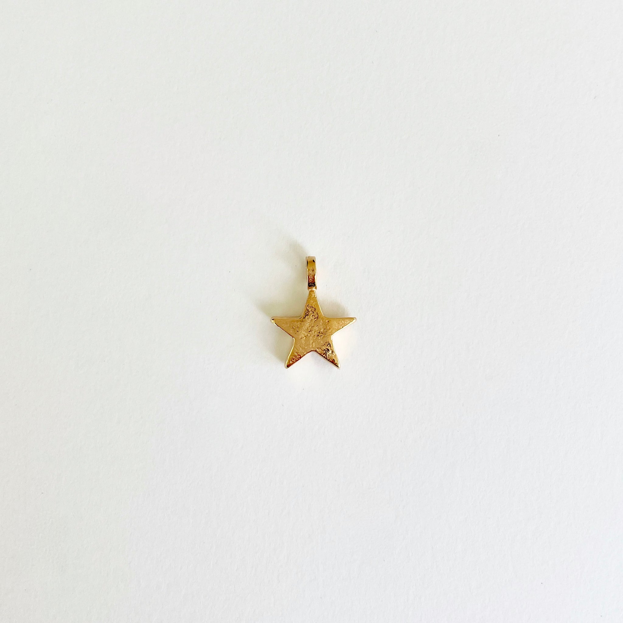 Gold star charm