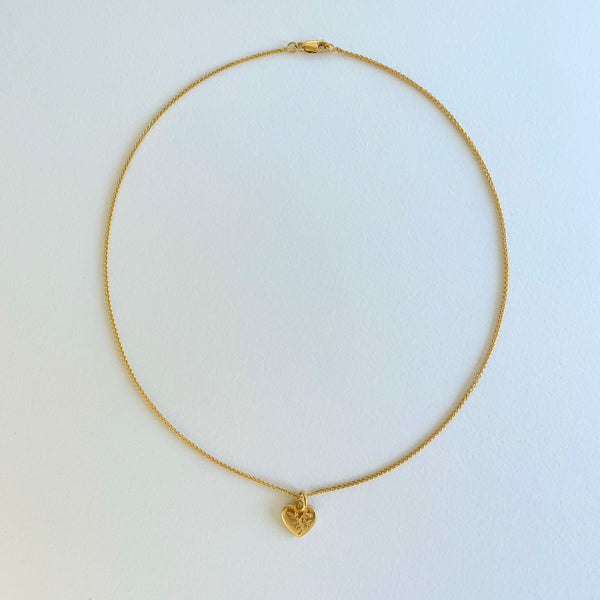 Gold necklace with engraved heart