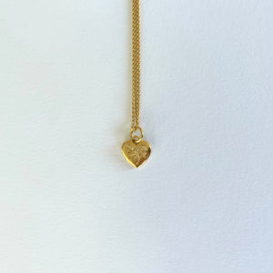 Gold necklace with engraved heart