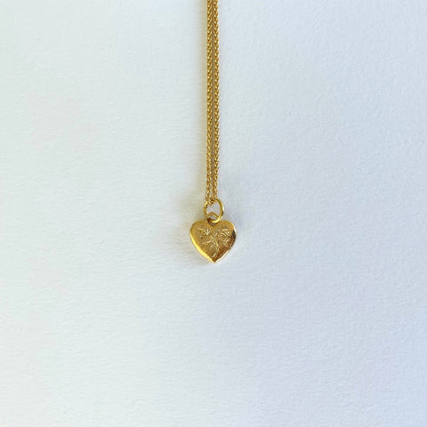 Gold necklace with engraved heart