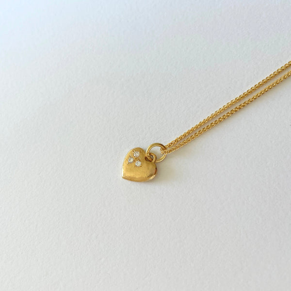 Gold necklace with heart and diamonds