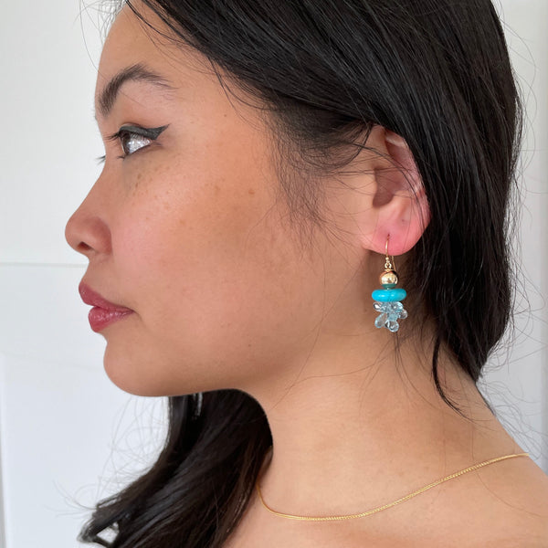 Gold earrings with turquoise and blue topaz