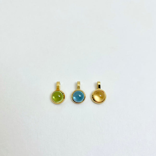 Gold charm with citrine