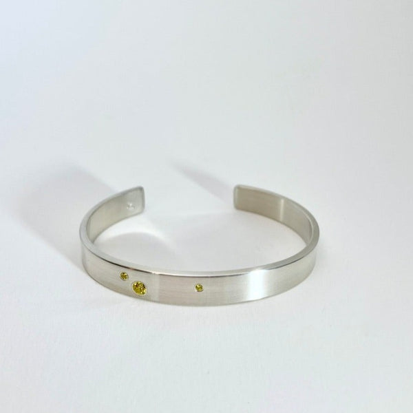 Silver cuff with yellow diamonds