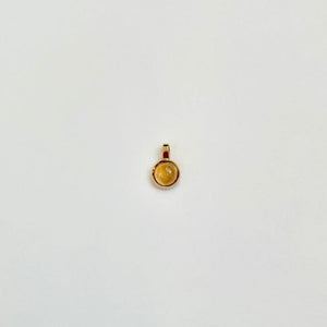 Gold charm with citrine
