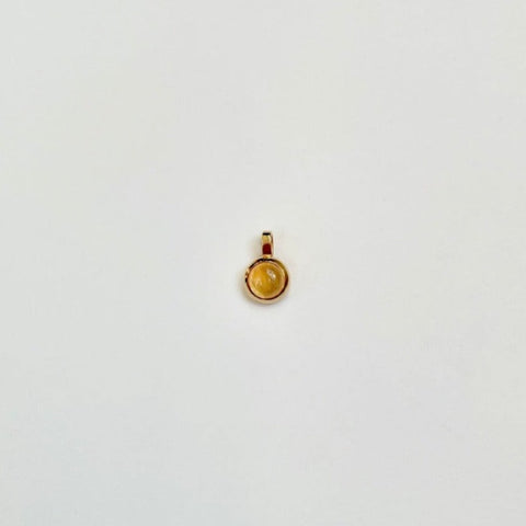 Gold charm with citrine
