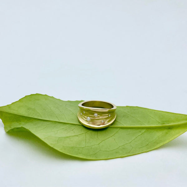 Gold ring with white diamonds