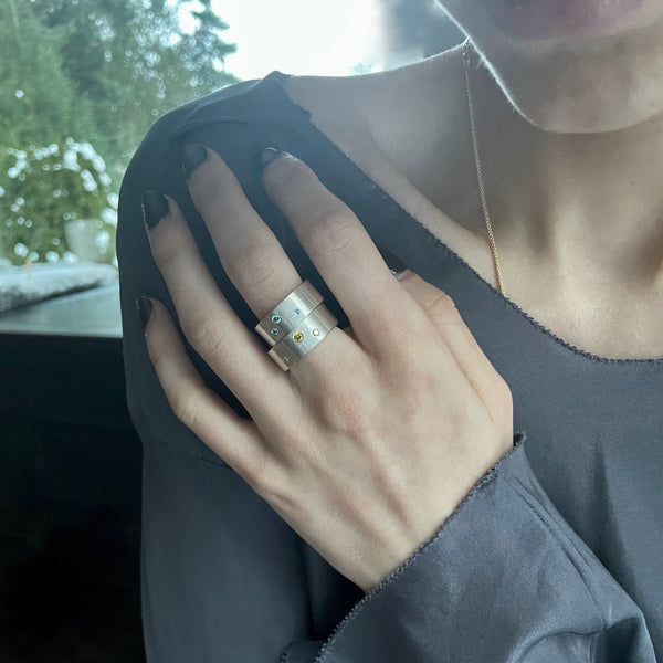 Silver ring with blue diamonds