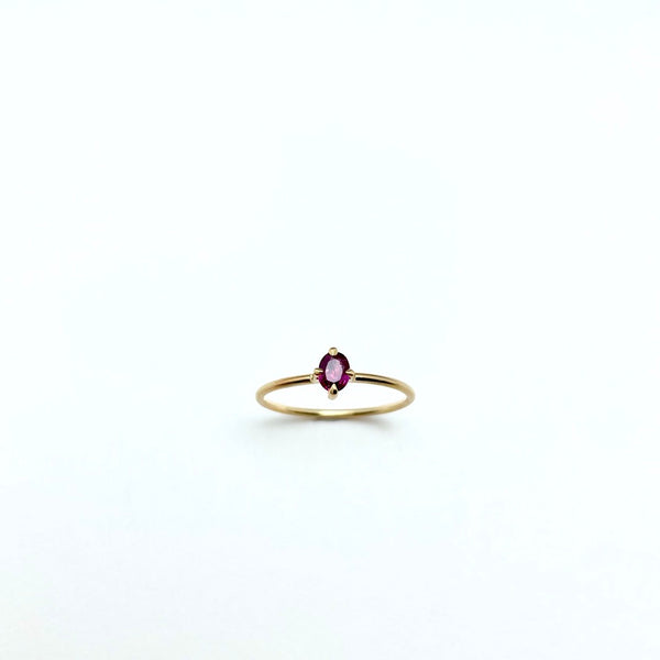 Gold ring with oval ruby 4 prong