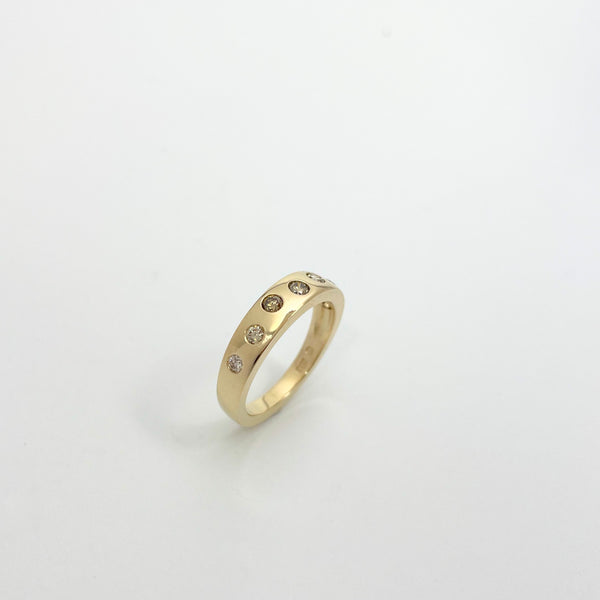 Gold ring with brown diamonds