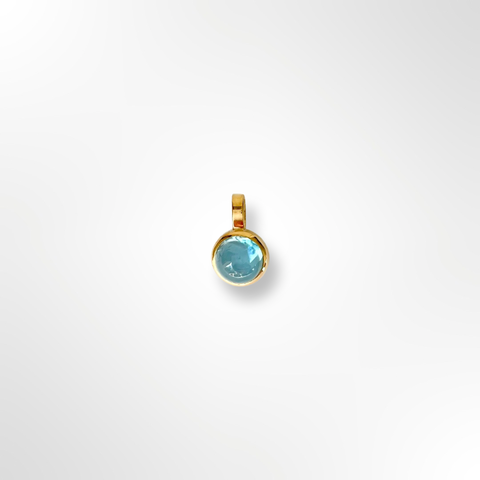 Gold charm with blue topaz