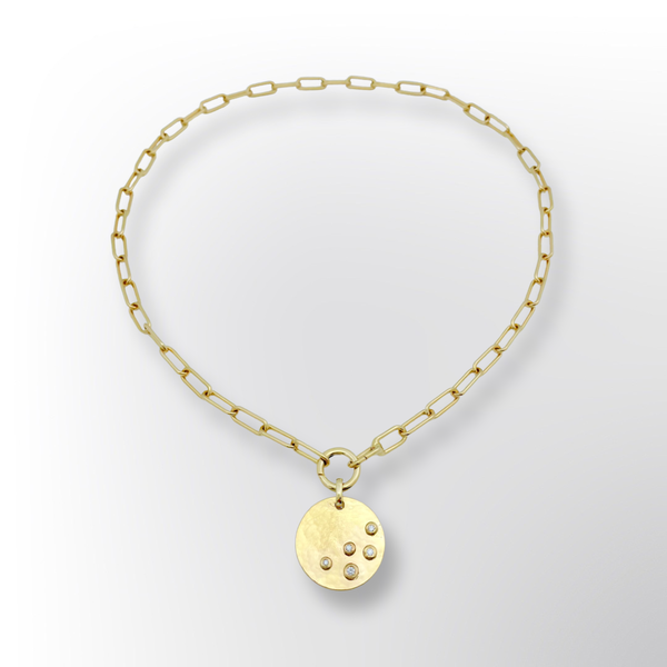 Gold necklace with hammered disk and 5 diamonds