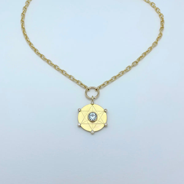 Gold necklace with light blue sapphire and diamonds