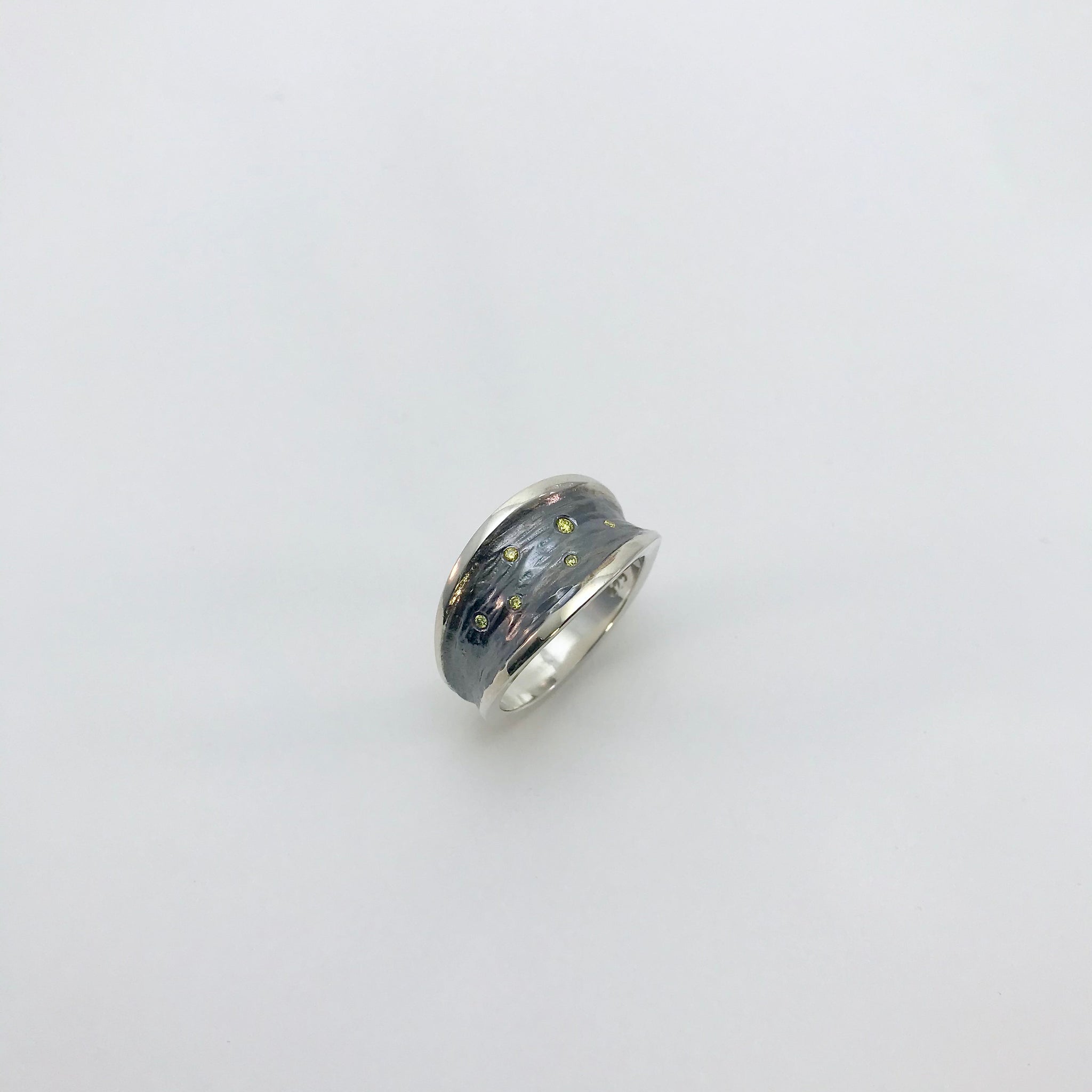 Silver ring with yellow diamonds