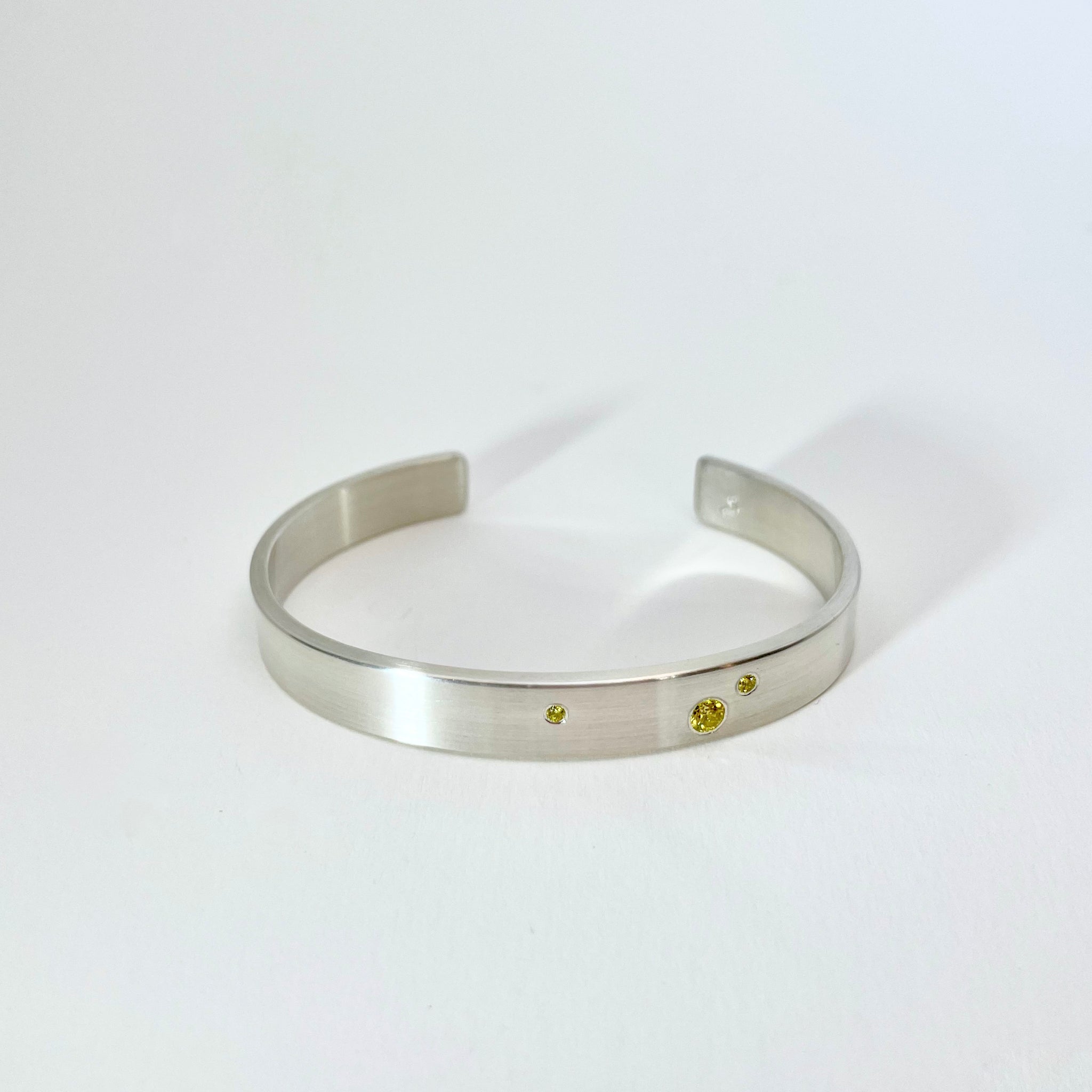 Silver cuff with yellow diamonds