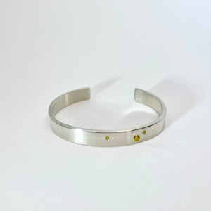 Silver cuff with yellow diamonds