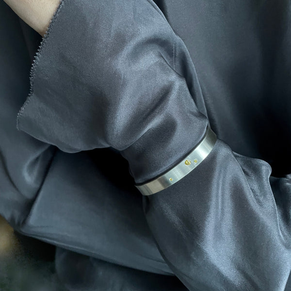 Silver cuff with yellow diamonds